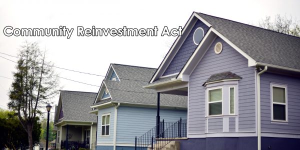 Three multi color one-story homes are in a row.