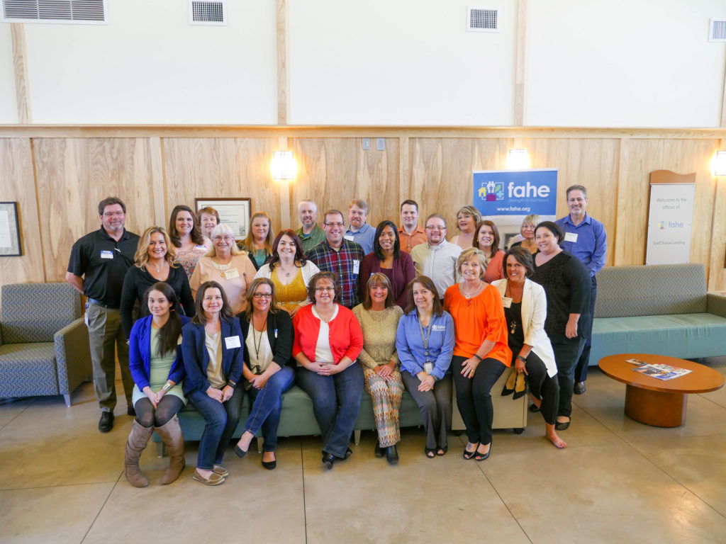 Group of people smiling at Fahe's Mortgage Broker Bootcamp.