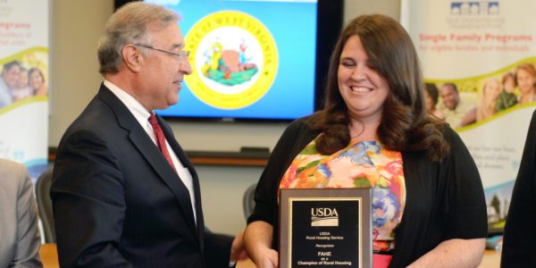 USDA RD Director Tony Hernandez presenting an award to Laura Meadows of Fahe.