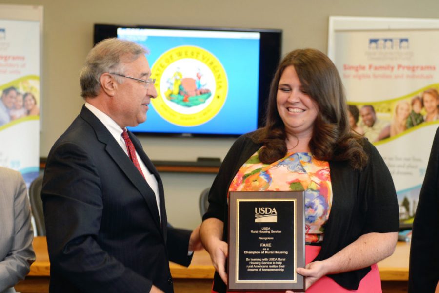 USDA RD Director Tony Hernandez presenting an award to Laura Meadows of Fahe.