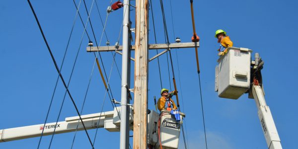 Utility workers working on power lines.