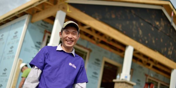 A new homeowner works on his house during a blitz build hosted by Fahe Member Knoxville Habitat for Humanity.